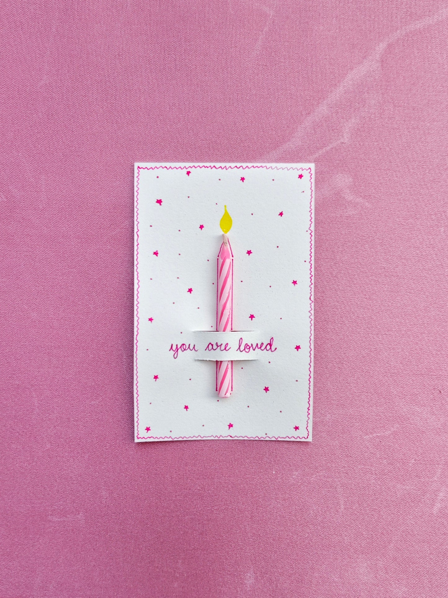 Pink color card with calming cute candle for gifting needs